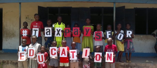 Pupils at the Activista Free Holiday Coaching Lesson in Tionsha community in Benue State Nigeria taking action as part of the Tax Power Campaign Pupils at the Activista Free Holiday Coaching Lesson in Tionsha community in Benue State Nigeria taking action as part of the Tax Power Campaign